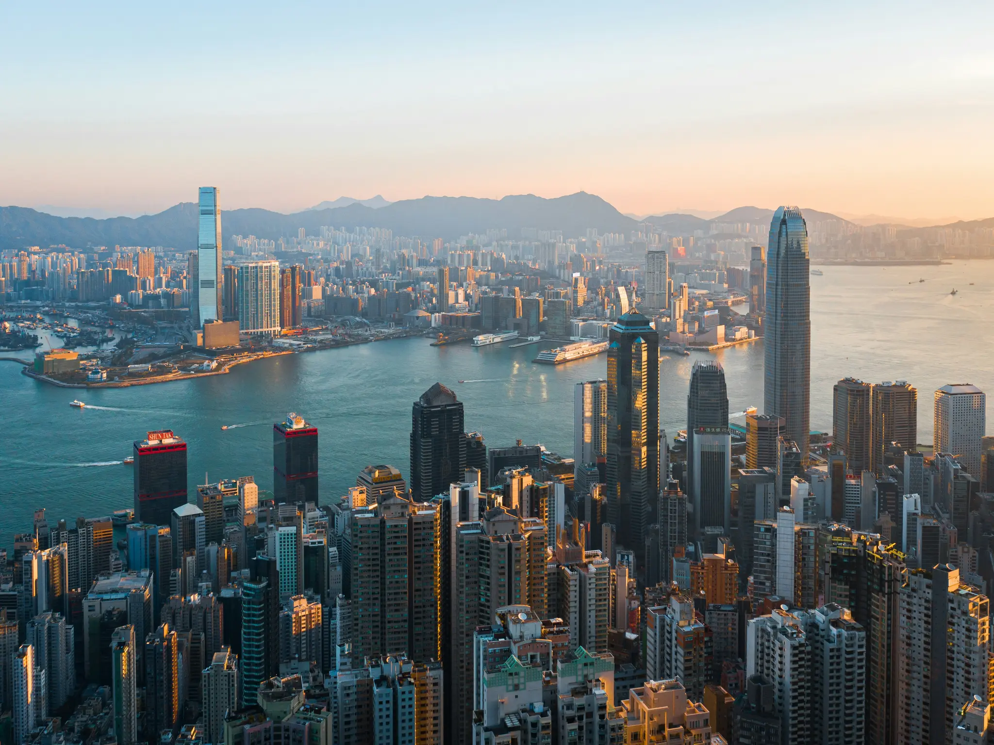 Victoria Harbour and the Hong Kong skyline at golden hour